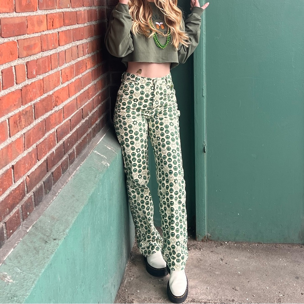 Green and off-white graphic corduroy jeans